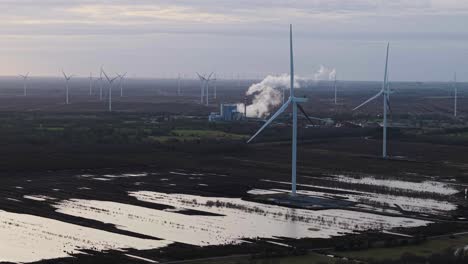 wind turbines in irish bogland with edenderry power station in the background