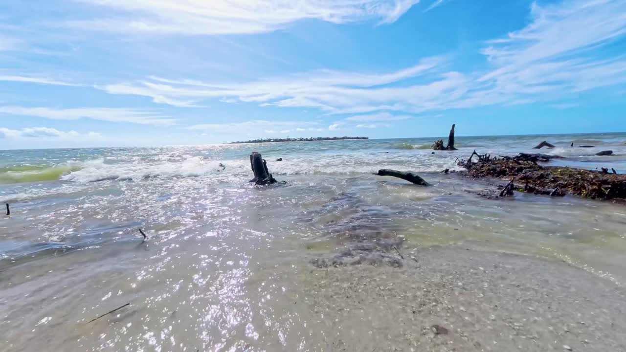 Waves crashing on the beach at Keewaydin Island