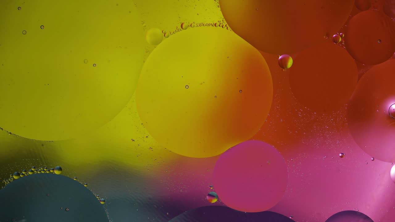 la macroestructura de las burbujas de aceite coloridas. movimiento caótico. fondo multicolor abstracto. patrón