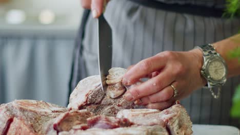 woman doing incisions on beef rolled in flour