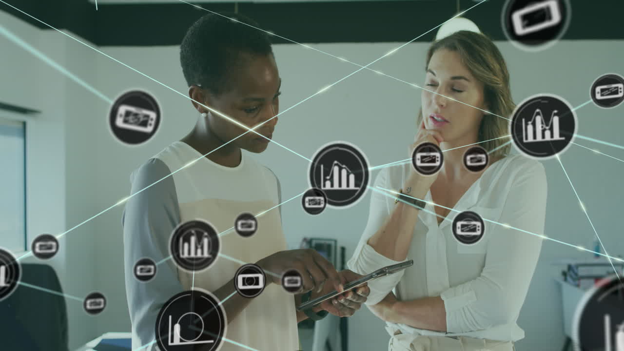 Animation of icons connected with lines over diverse coworkers discussing reports on digital tablet