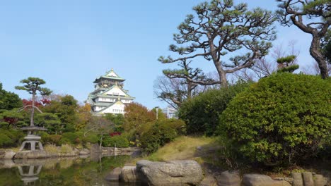 woman visiting osaka castle in japan