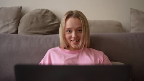 young woman having a video call on her laptop