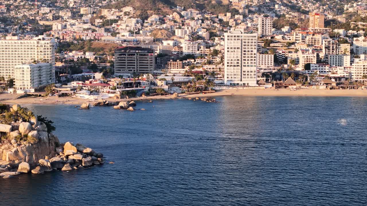 Shot of Acapulco at sunset with hurricane destruction