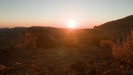 Sunrise-above-horizon-in-volcanic-landscape-on-Tenerife,-Canary-Islands-in-sprin