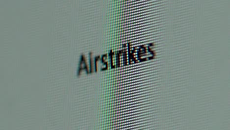 term airstrikes being typed out on computer screen extreme macro