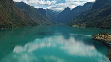 aerial shot over the olden lake approaching the jostedalsbreen glacier