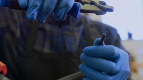 man repairing bicycle in workshop 4k