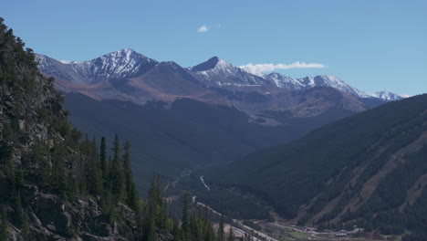 Snowy-peaks-Copper-Mountain-Leadville-Colorado-aerial-cinematic-drone-early-fall-yellow-aspen-trees-colors-afternoon-Keystone-Breckenridge-Silverthorne-Vail-Ten-Mile-Range-blue-sky-reveal-right-motion