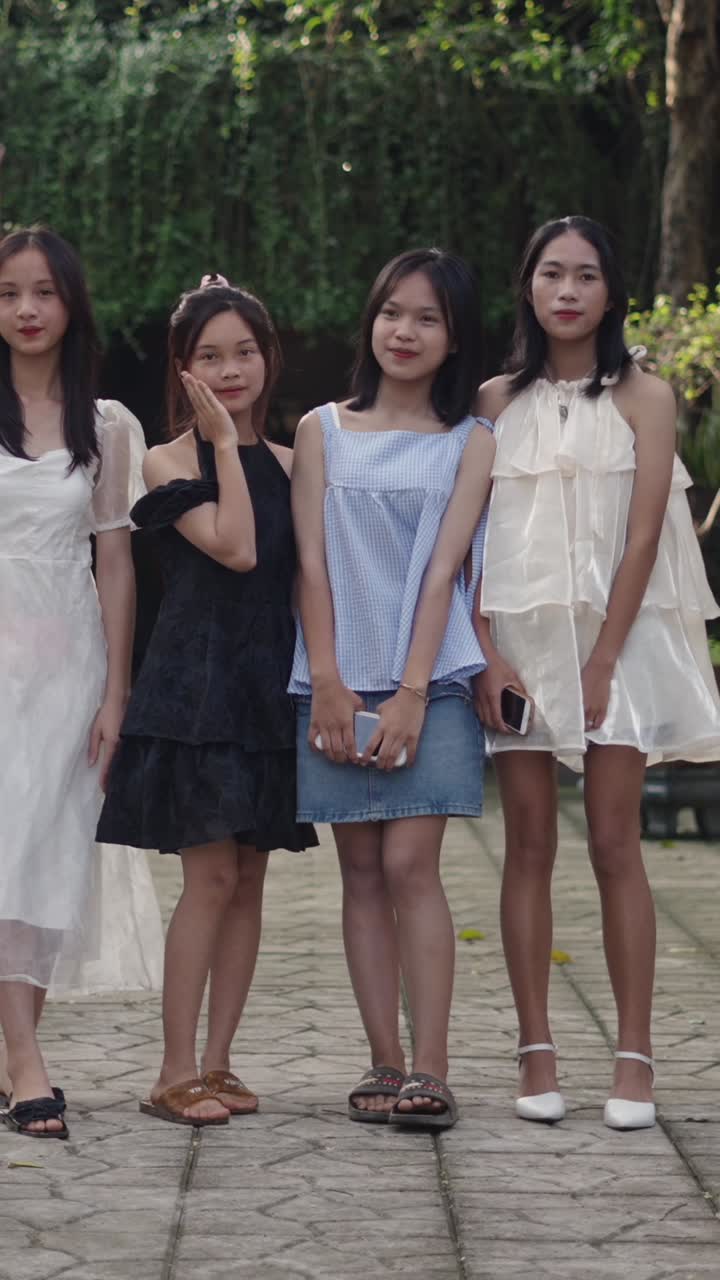 Group of young women in dresses