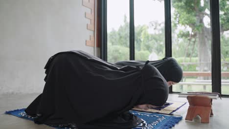young muslim women are doing prayers for the blessing of god allah.