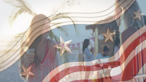 Multiple-stars-on-blue-stripes-against-two-caucasian-women-taking-on-the-beach