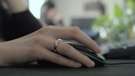 Married-woman-scrolling-on-a-mouse-in-the-office