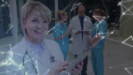 Digital-animation-of-glowing-network-of-connections-against-female-doctor-using-digital-tablet-and-m