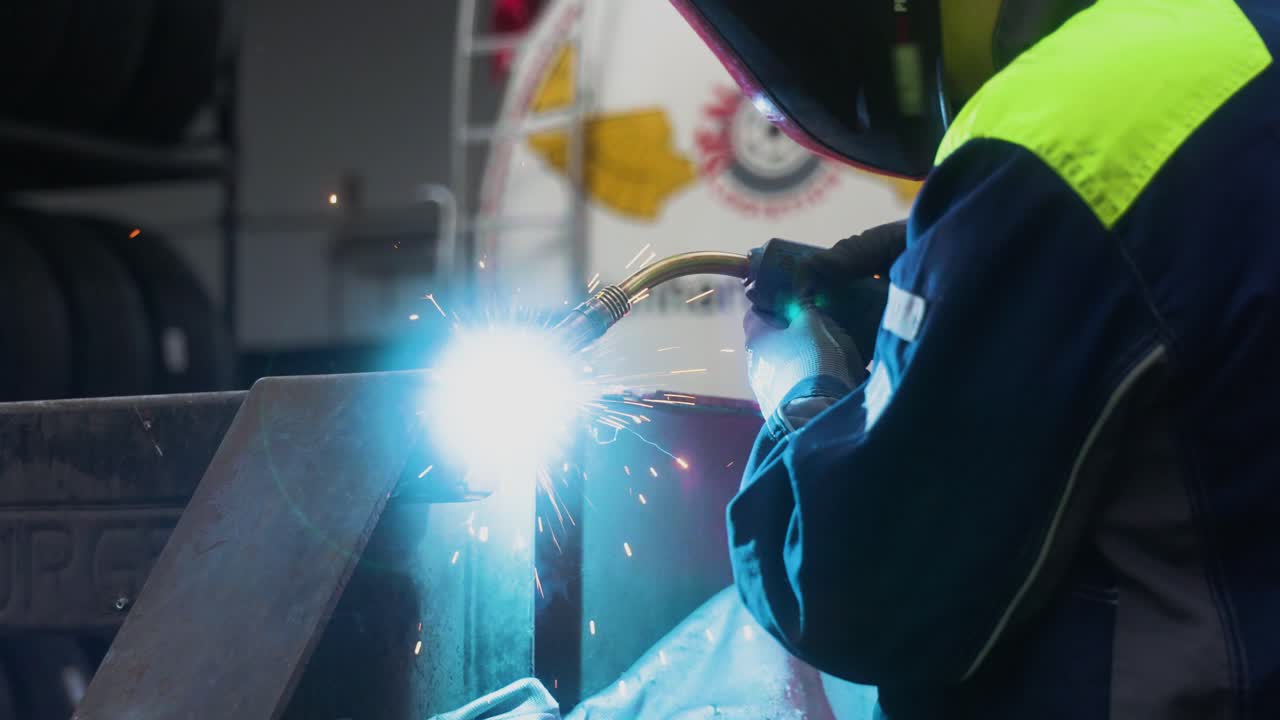 Man welding a steel frame