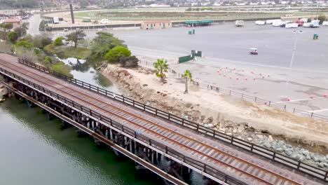 drone view of railroad tracks over water delmar fairgrounds