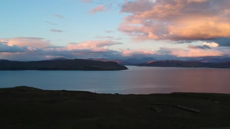 Golden-hour-panning-drone-shot-of-Scottish-mountain-lake