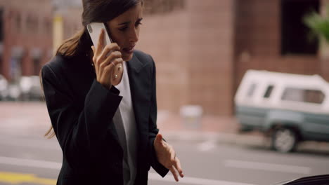 a-woman-talking-on-her-cellphone-after-her-car