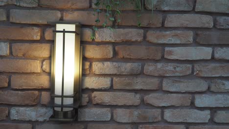 modern outdoor wall lamp on brick wall