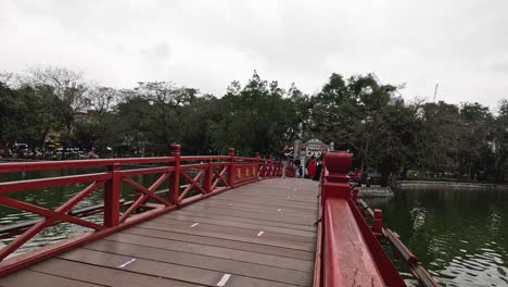 people walking on the huc bridge