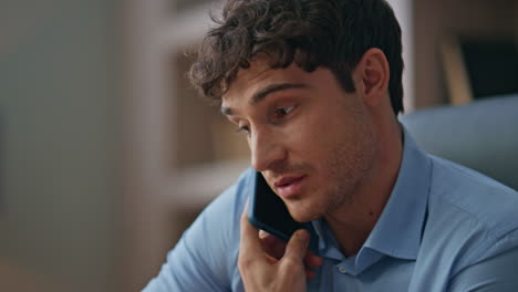 Young professional answering mobile phone call closeup. Busy sales manager talk