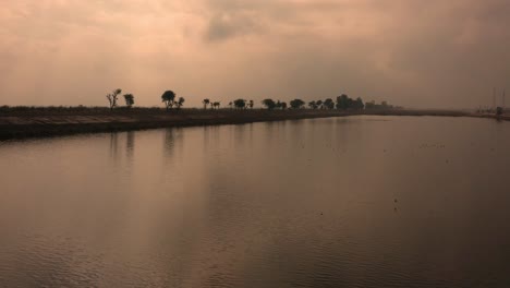 sunset drone videos flying over the indus river in moro sindh city