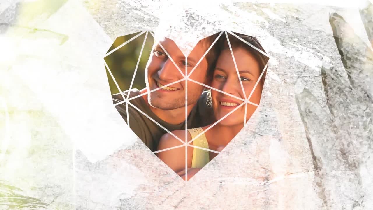 pareja abrazándose entre sí a través del primer plano en forma de corazón blanco