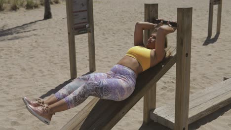 woman in sportswear training in gym outside