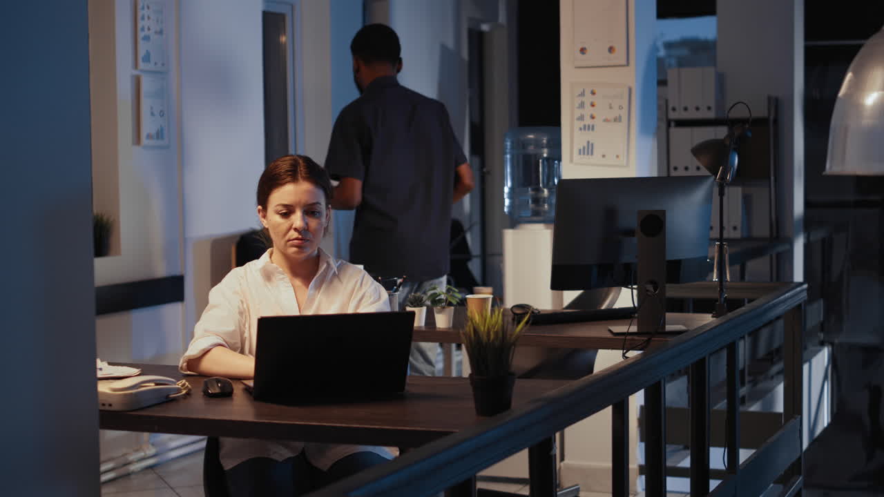 Portrait of confident happy manager working on laptop to plan report