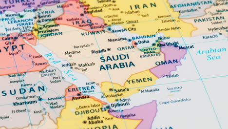 close-up of the country word saudi arabia on a world map with the detailed name of the capital city