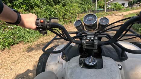 first-person view of an atv ride outdoors