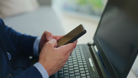 Businessman-Writes-Texts-on-Smartphone