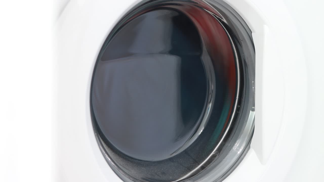 The washing machine washes clothes.
