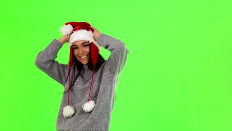 shot of a charming santa claus girl having fun at studio