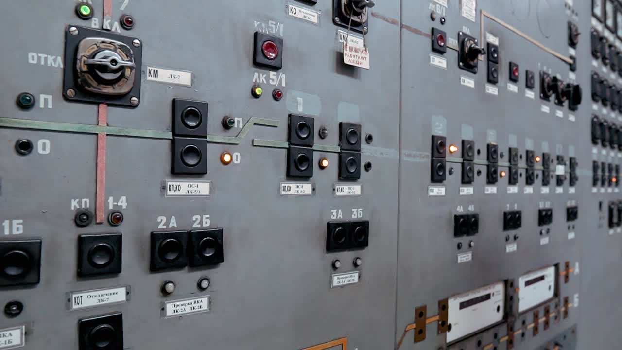 Control panel at a power station. Buttons, switches and devices for controlling electricity. Old dashboard