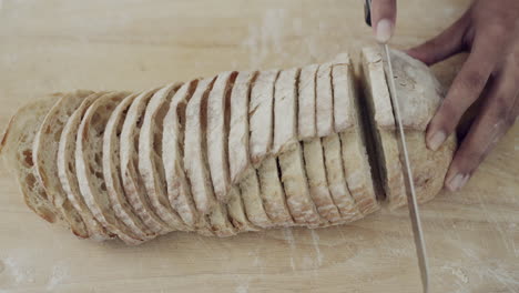 bread, knife and top view of hands in kitchen