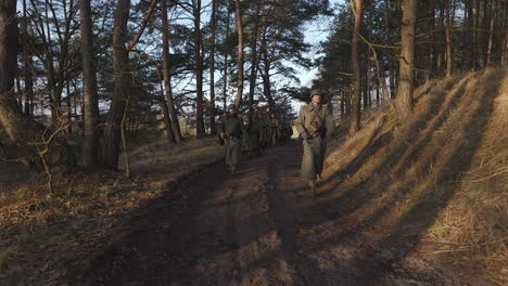 german soldiers marching through a forest