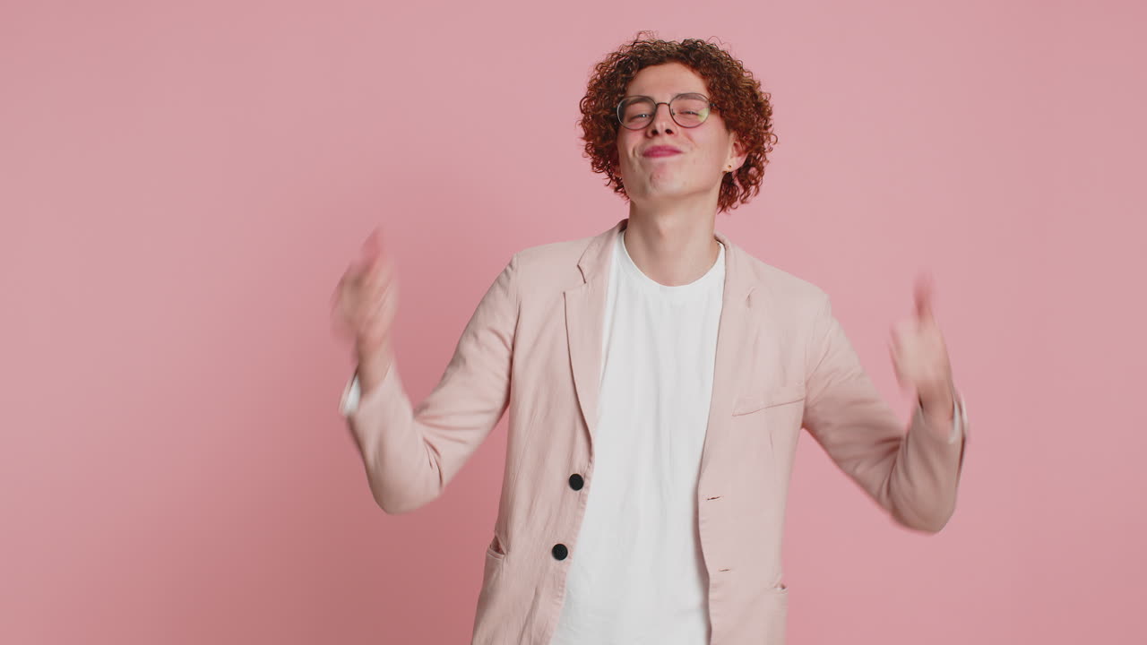 Happy man greatly approves your suggestion shaking head approval yes good idea like feedback