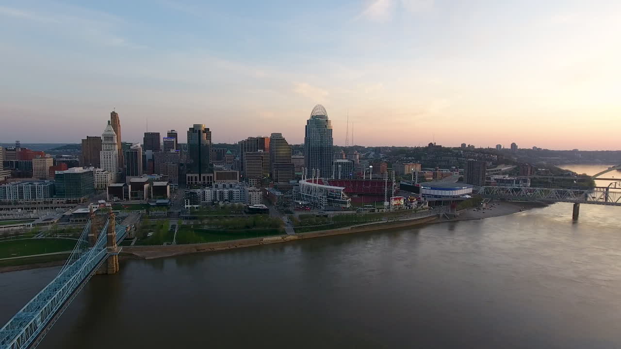 Drone shot of downtown Cincinnati Ohio slowly revealing the Ohio River and the John A