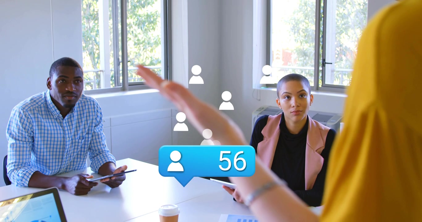 Two business colleagues watching presenter gesturing, causing user icons rising, showing growth