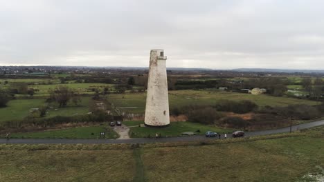 historic leasowe lighthouse maritime beacon landmark aerial coastal countryside wirral view low to high left