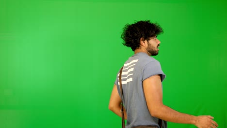 indian-tourist-walking-on-road-with-green-background---green-screen