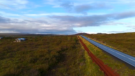 parallel to a long icelandic road over a sunset