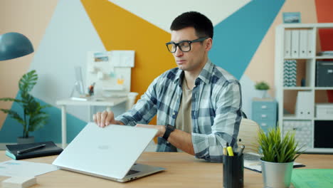 man working and meditating at his desk