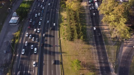 Aerial-flyover-Avenida-General-Paz-2-Highway-during-rush-hour-time-in-the-evening---tracking-shot