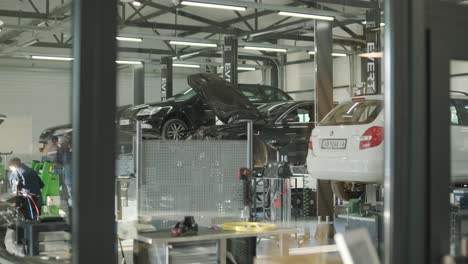 cars undergoing maintenance in auto repair shop