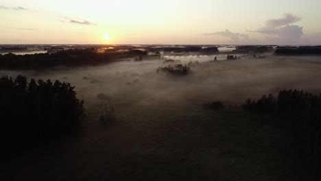 flight above sunset fog in golden hour after rain