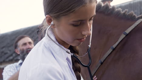 Woman-using-stethoscope-with-animal