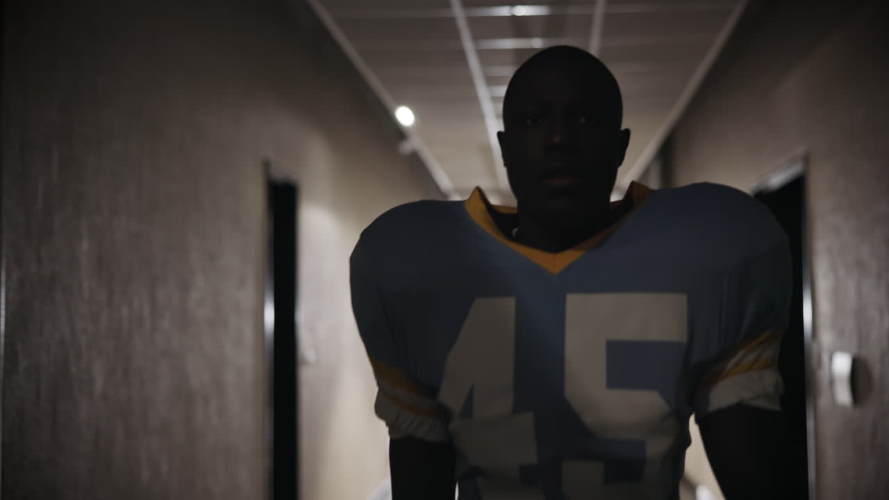 Football player in a hallway
