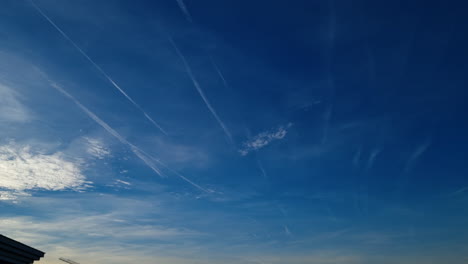 Time-lapse-of-heavy-air-traffic-with-many-aircraft-flying-in-the-blue-sky